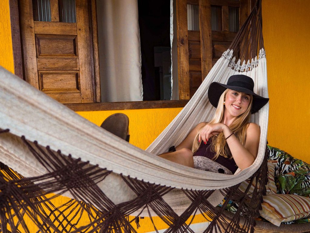 me lying in a beige hammock on the balcony of our room at the guesthouse we were staying at in Lencois