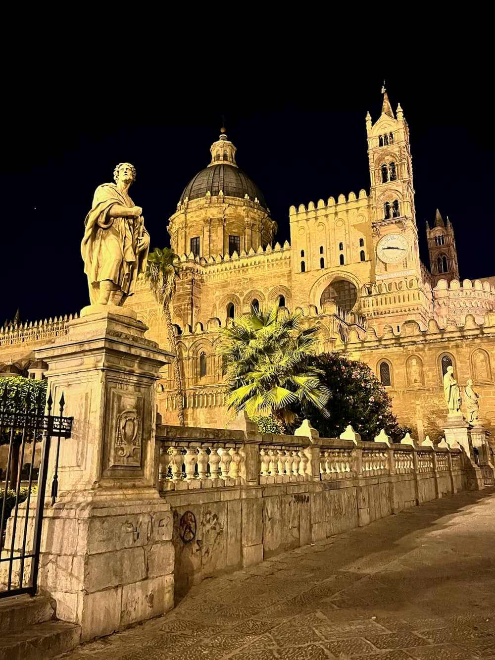 The illuminated facade of Palermo Cathedral at night, a must-visit place if you only have one day in Palermo.