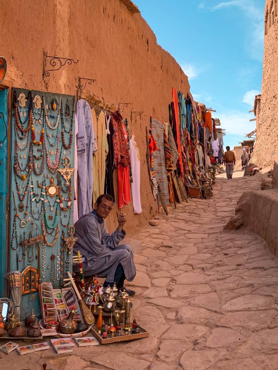 a vendor selling Moroccan jewellery on a street in Ait Ben Haddou