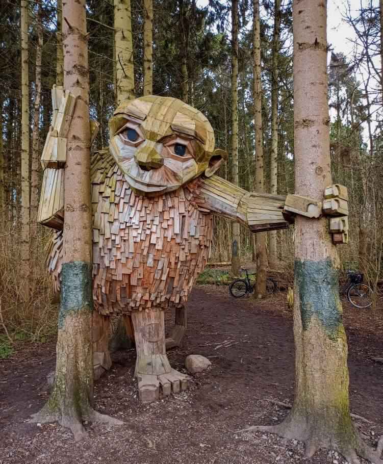 A scrap wood sculpture called Little Tilde which is also a part of the Six Forgotten Giants sculptures by Thomas Dambo