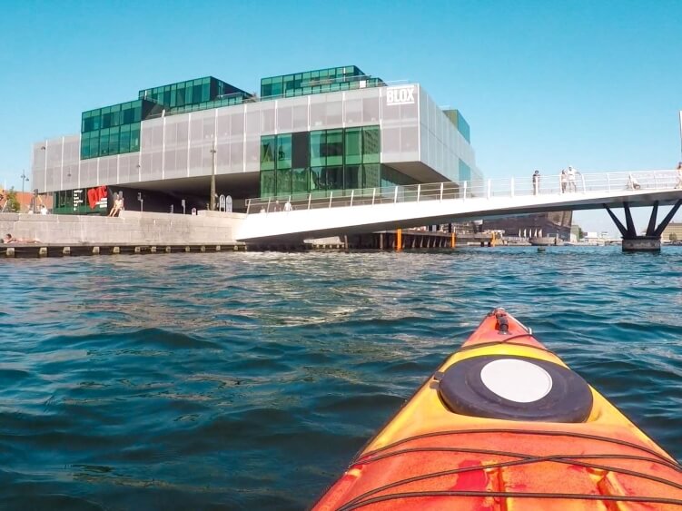 One of the most unique things to do in Copenhagen is paddling through the city canals on a kayak.