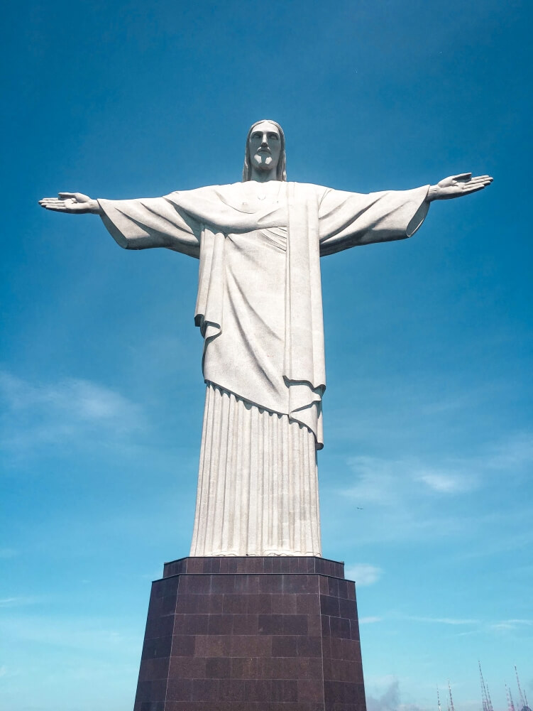 a towering art deco sculpture called the Christ the Redeemer on top of Corcovado mountain in Rio de Janeiro, a must-see attraction when visiting the city