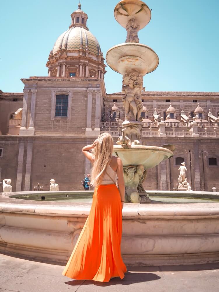 Me standing in front of the centerpiece of the Pretoria Fountain in Palermo