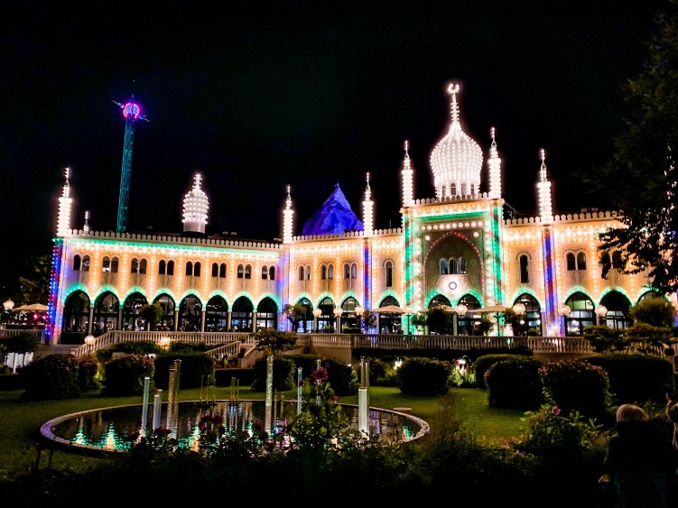 Illuminated facade of a building in Tivoli Gardens, a place that should be in your Copenhagen bucket list