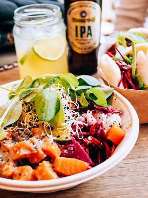 Salmon poke bowl at Tivoli Food Hall, one of the top markets for street food in Copenhagen