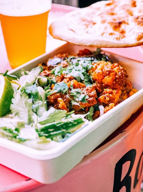 Indian vegetarian curry with rice and naan bread at Bridge Street Kitchen in Copenhagen