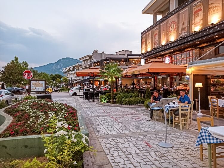 A row of restaurants with outdoor seating in the town of Kalambaka, Greece