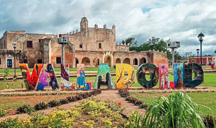 A colorful Valladolid sign in Sisal Park in front of the Convent of San Bernardino de Siena 