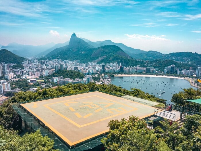 Morro da Urca helipad with a backdrop of the winding coastline of Rio de Janeiro, the starting point of our 10 days in Brazil