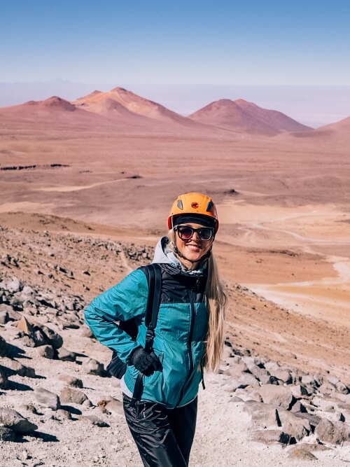 A woman hiking the Cerro Toco volcano in the Atacama Desert