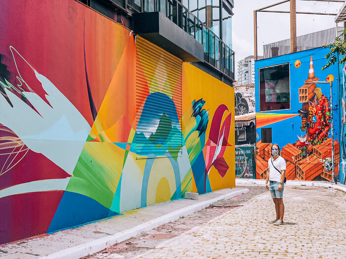 A man admiring the vibrant street art of Beco do Batman aka the Batman Alley, one of the best things to do in São Paulo