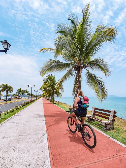 a man riding a bicycle on Amador Causeway