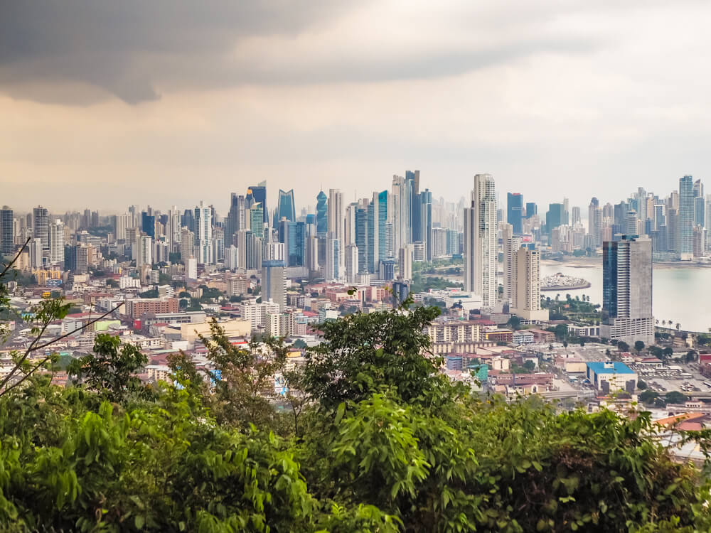 A panoramic view over downtown Panama City from the top of Cerro Ancon hill on a cloudy day.