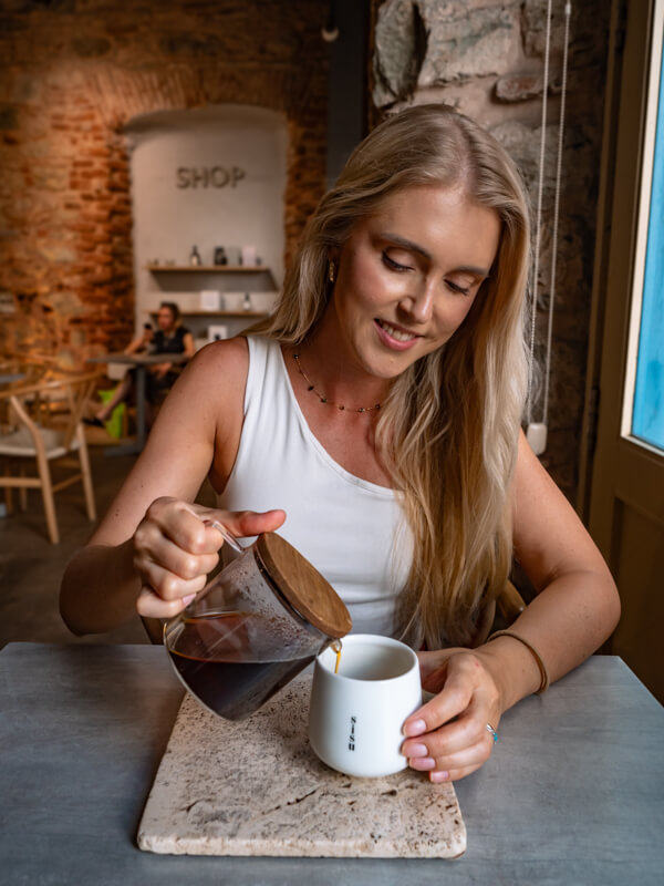 Me pouring myself a cup of Geisha coffee at a specialty coffee shop in Casco Viejo.