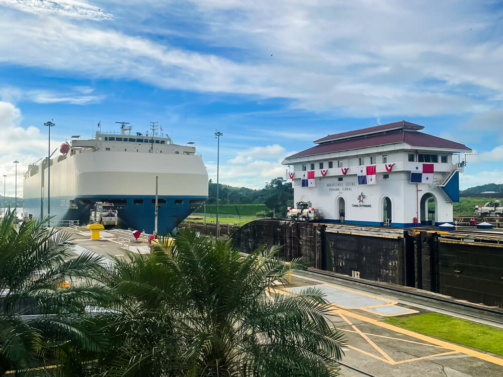 A large ship on its journey to cross the Panama Canal at Miraflores Locks.