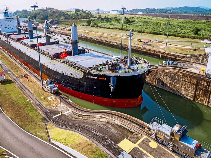 a large ship passing through the Panama Canal at Miraflores Locks visitor center, one of the most famous attractions in Panama City