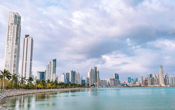 A view of Panama Bay and the modern skyscrapers of downtown Panama City on a cloudy day.
