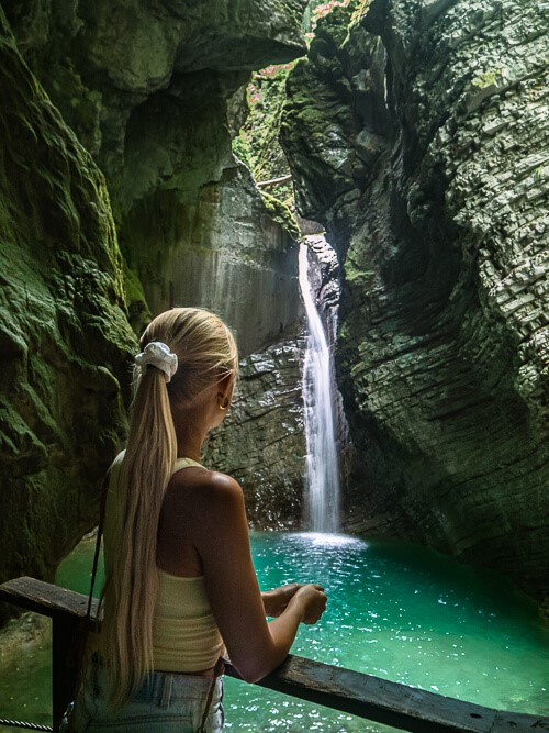 Me admiring the breathtaking Slap Kozjak Waterfall and its emerald green pool