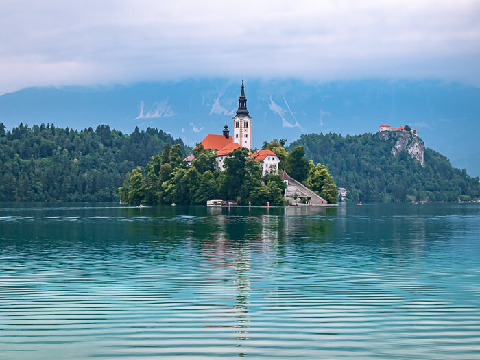 Lake Bled island with its fairytale-like church surrounded by emerald water, one of the most beautiful places in Slovenia