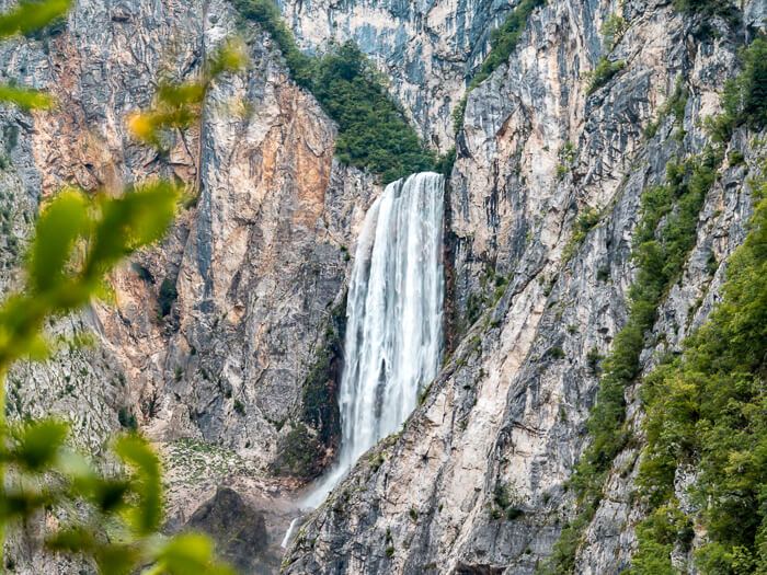Boka Waterfall surrounded by vertical rock walls - one of the mightiest and tallest Slovenia waterfalls