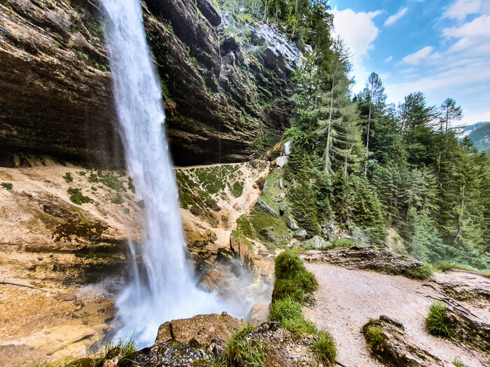 Peričnik Waterfall, one of the coolest Slovenia waterfalls since you can walk behind it
