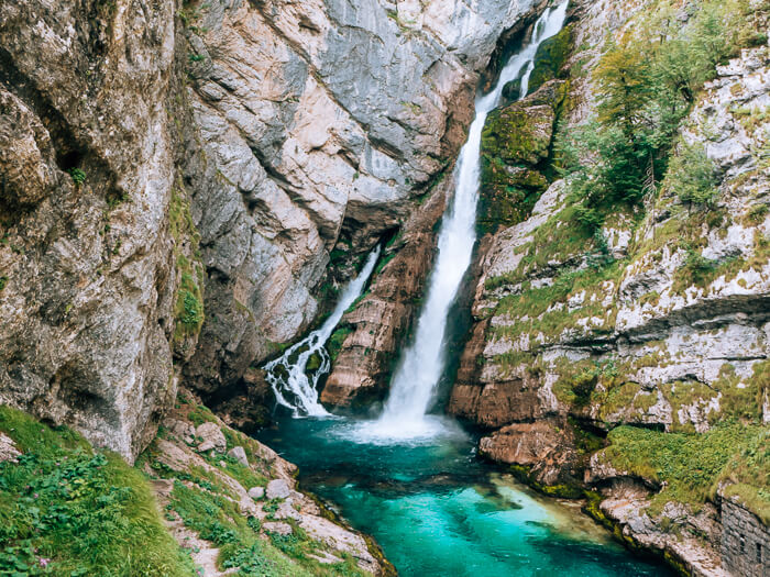 Majestic Savica Waterfall and its turquoise basin, one of the most famous waterfalls in Slovenia