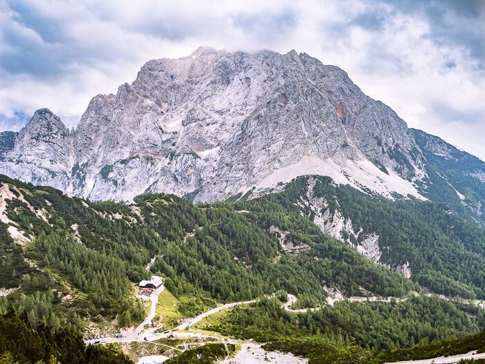 Winding roads of Vrsic Pass surrounded by Julian Alps, one of the coolest places to visit on a Slovenia road trip.