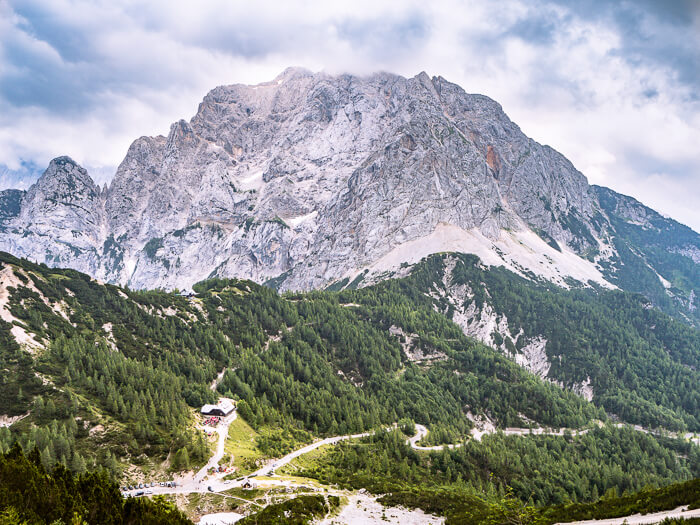 Winding roads of Vrsic Pass surrounded by Julian Alps, one of the best places to include in your Slovenia road trip.