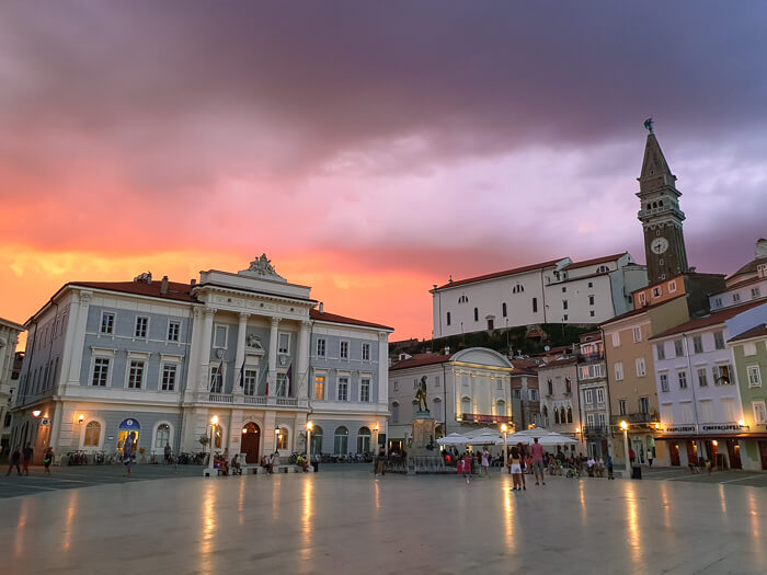 colorful sunset sky and historical houses at Tartini Square in Piran, one of the many beautiful places in Slovenia