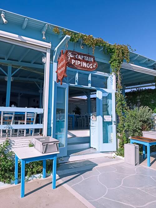 blue wooden facade of a traditional Greek taverna