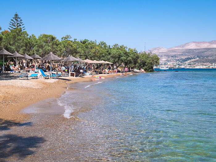 sunbeds and umbrellas on the sandy Psaraliki Beach, one of the most popular Antiparos beaches