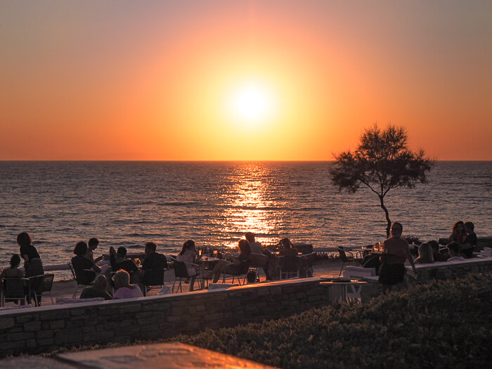 Waterfront restaurant with a sunset view at Sifneiko Beach, one of the best beaches in Antiparos Island, Greece