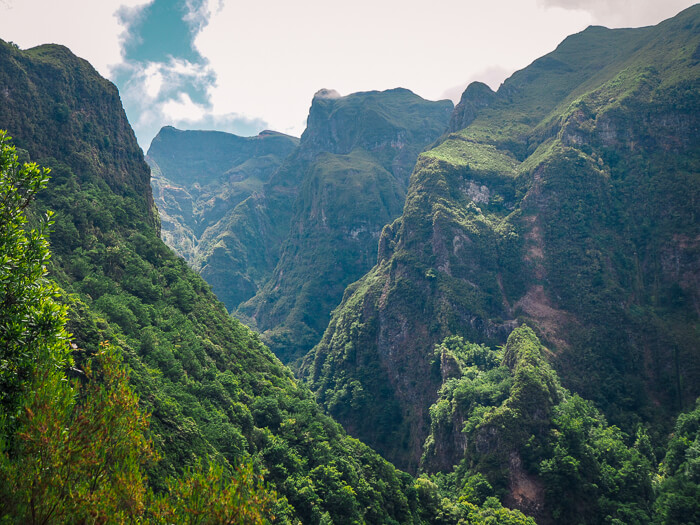 Lush green mountains on the Caldeirão Verde levada walk, one of the best hikes in this 7-day Madeira itinerary.