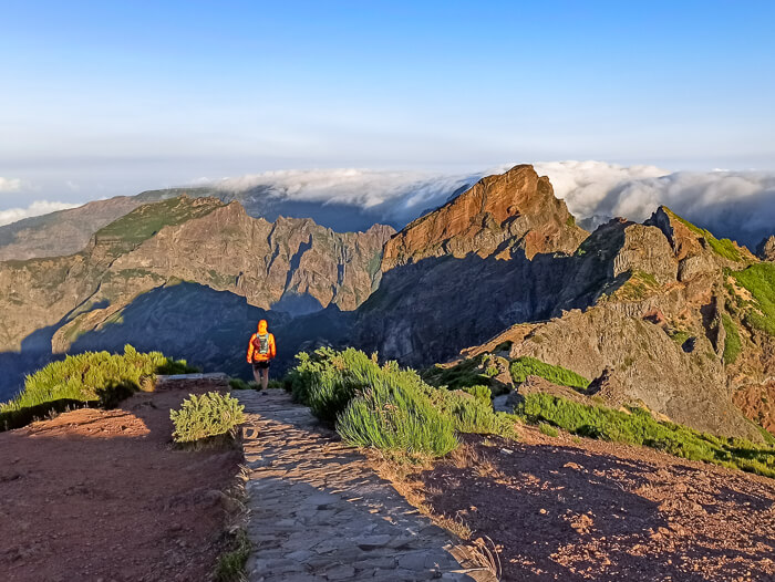 Sharp mountain peaks surrounded by clouds on the hike from Pico do Arieiro to Pico Ruivo, one of the best hikes in Madeira