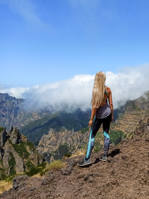 Me looking at the views along the Pico do Arieiro to Pico Ruivo trail, one of the best hikes in Madeira
