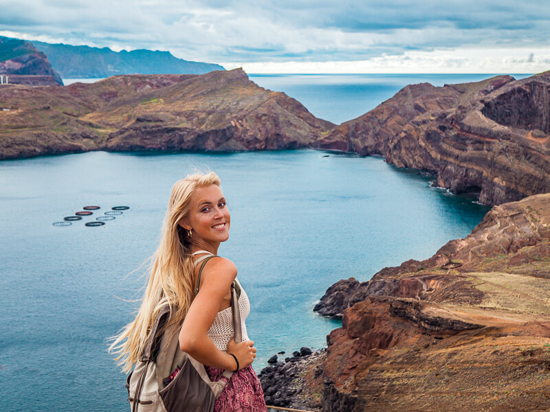 A woman hiking along the rocky coastal trail at Ponta de São Lourenço, a place that needs to be on every Madeira itinerary