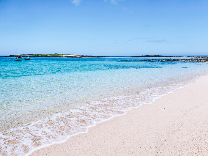 White coral sand and calm crystal clear water of the secluded Manglecito Beach.