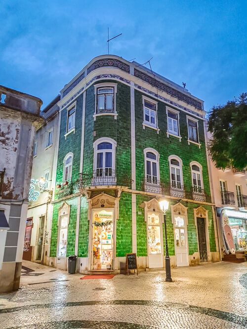 A building with a green tiled facade in Lagos Old Town in Portugal