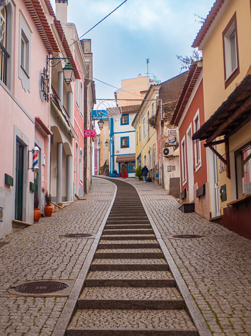 a steep street with colorful buildings in the historical center of Monchique