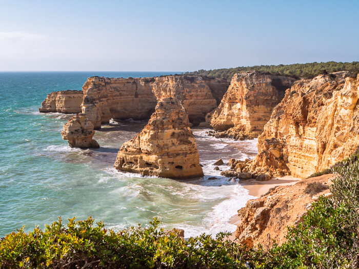 Colorful limestone sea stacks and cliffs at Praia da Marinha, one of the best beaches in Portugal