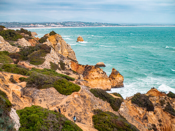 A picturesque coastline with golden cliffs and turquoise ocean near Lagos, Portugal