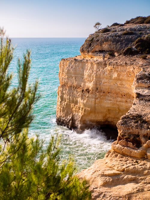 A coastal cliff in shades of yellow and orange at Seven Hanging Valleys hiking trail