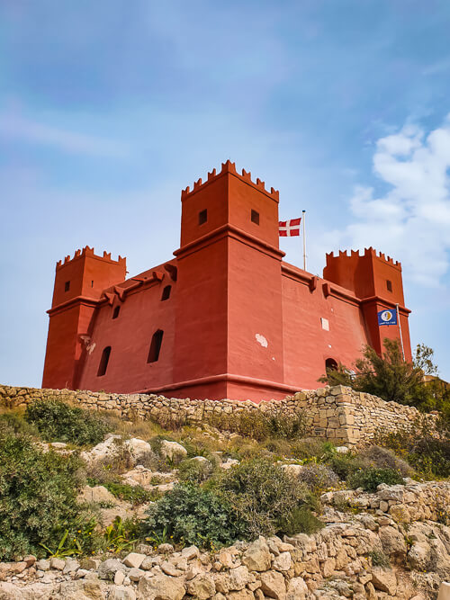 a bright red fortified watchtower known as Saint Agatha's Tower, a hidden gem in Malta