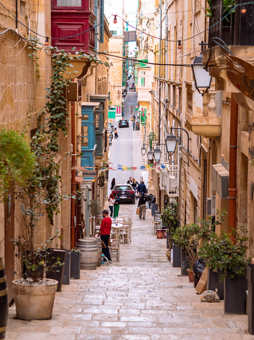 steep narrow streets lined with limestone facades in Valletta