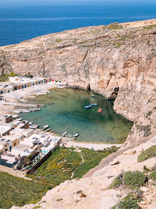 A view over Inland Sea, an emerald lagoon surrounded by cliffs on Gozo Island