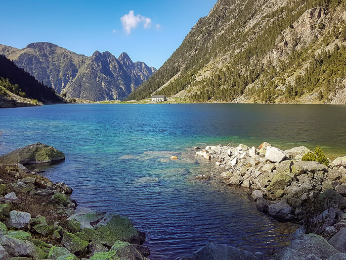 Pristine blue water surrounded by mountain scenery at Lac de Gaube lake, one of the best lakes in the French Pyrenees