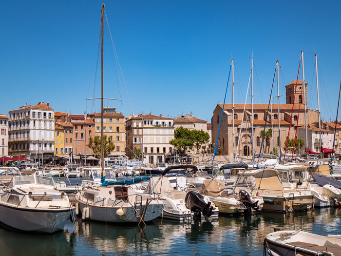 A picturesque old harbor with sailing boats at La Ciotat, a less-known spot to add to your Provence road trip