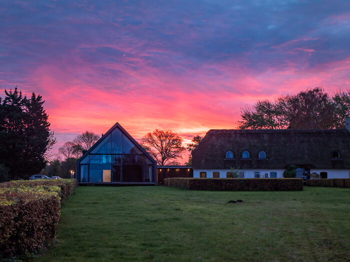 a vibrant sunrise in shades of orange, pink and purple at Tåsinge island in Southern Denmark