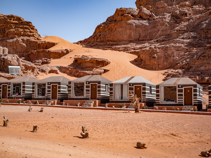 small cabins at a Bedouin desert camp in Jordan