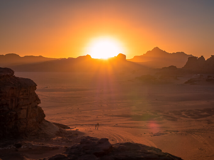 sunset over the rugged desert landscapes of Wadi Rum, a UNESCO World Heritage Site in Jordan